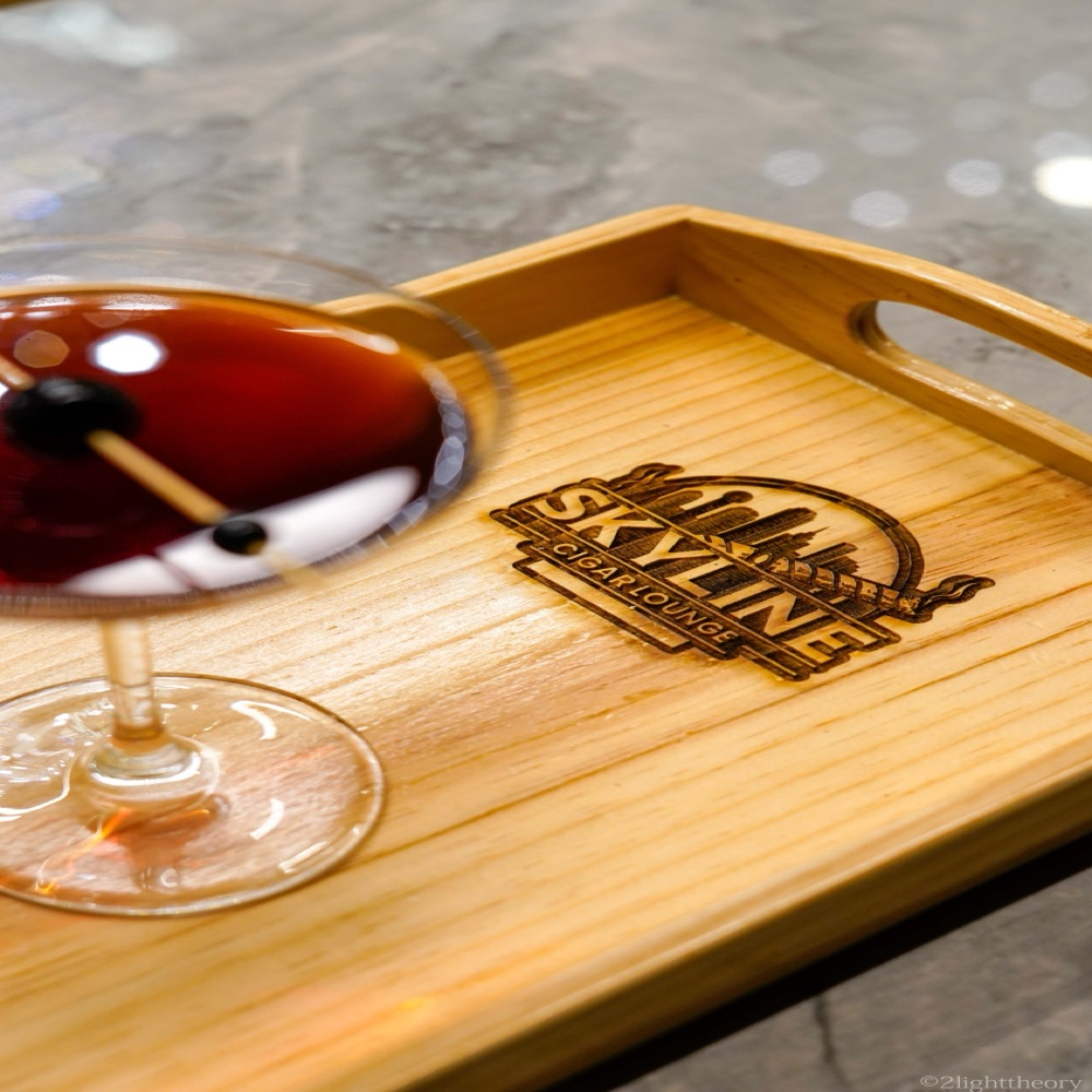 A cocktail on a Skyline serving tray